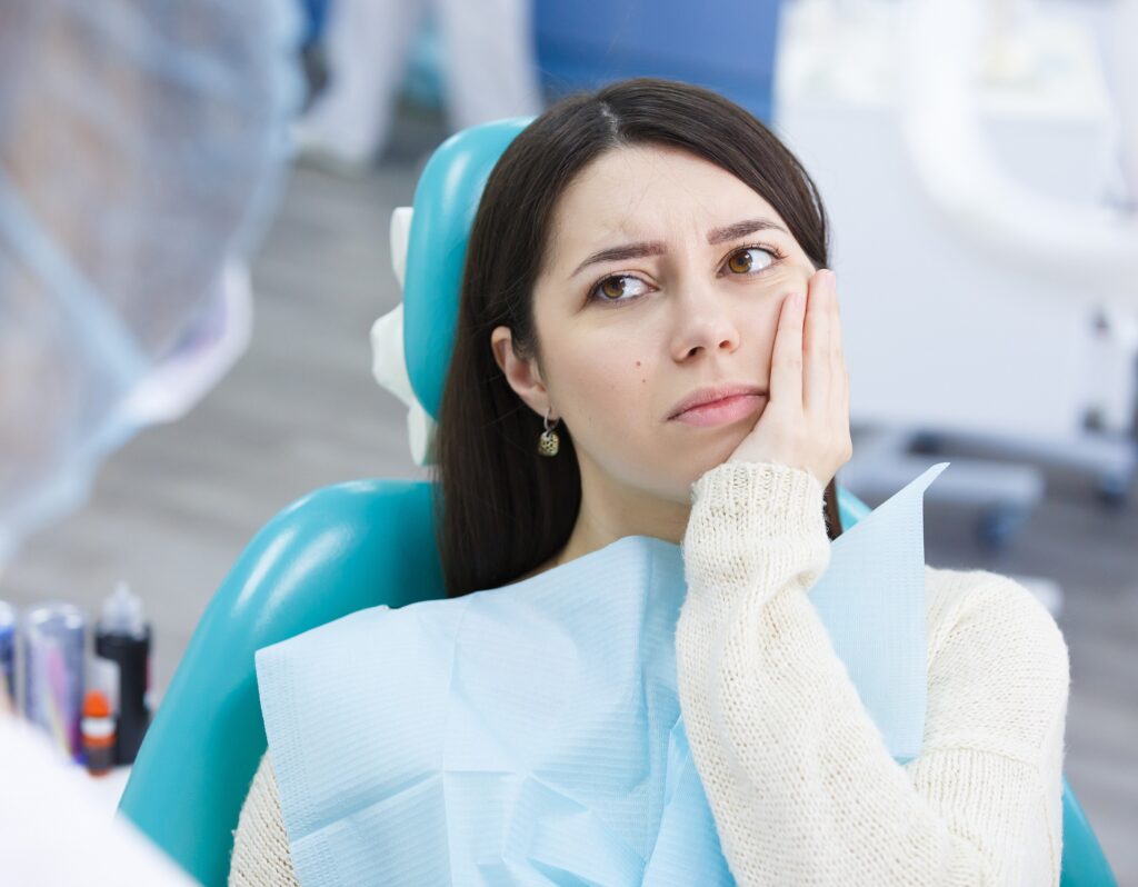 Patient needing a tooth extraction due to toothache in Carlsbad, Encinitas, or San Marcos